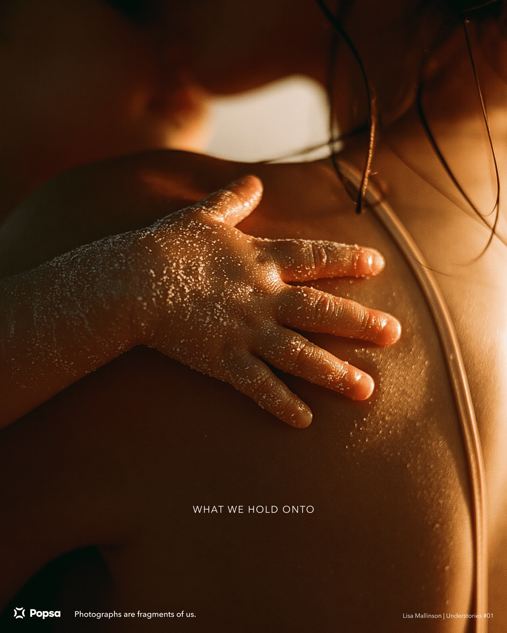 Popsa concept poster showing a close-up of a small child’s sandy hand resting on a parent’s shoulder. Text reads: “What we hold onto. Photographs are fragments of us.”
