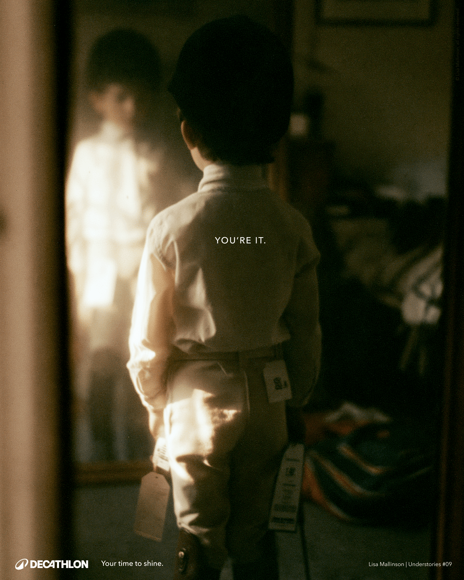 Decathlon concept poster showing a young fencer from behind, dressed in fencing gear and facing their reflection in a mirror. Text reads: “You’re it.” and “Your time to shine.”