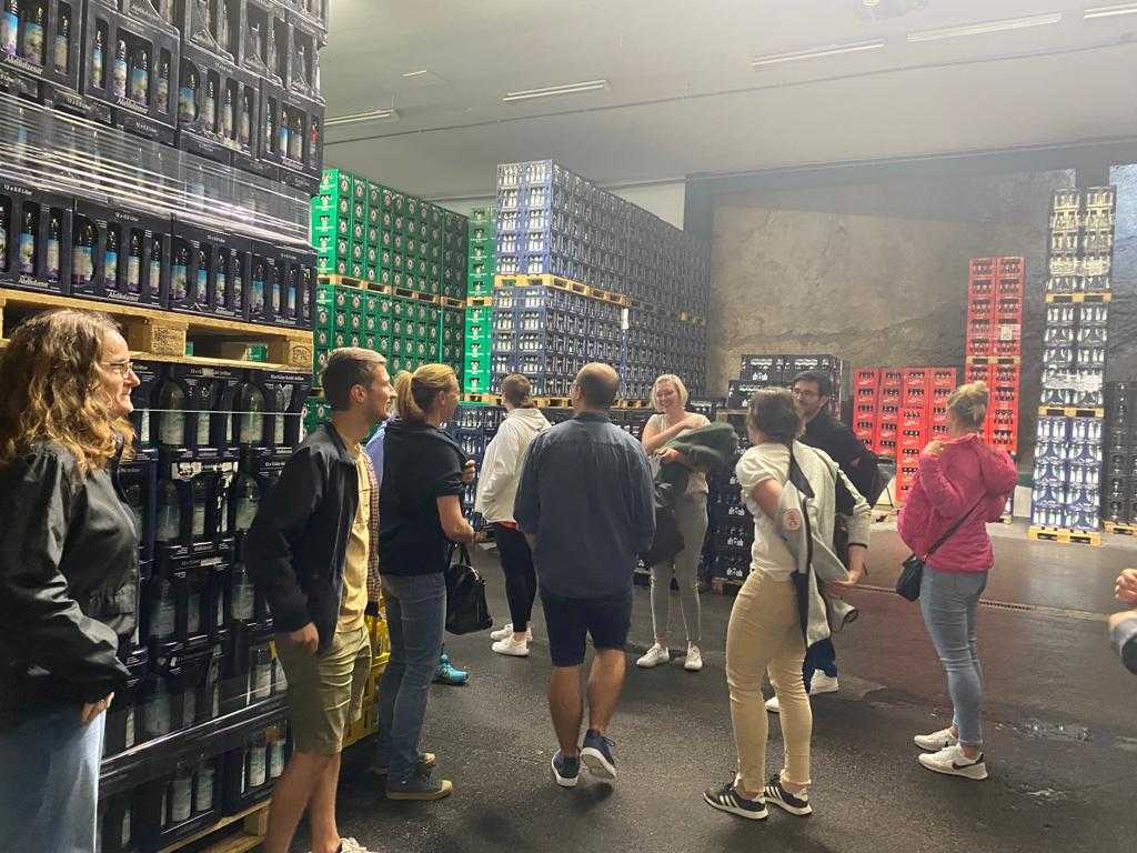 image of a distillery tour group learning about the process