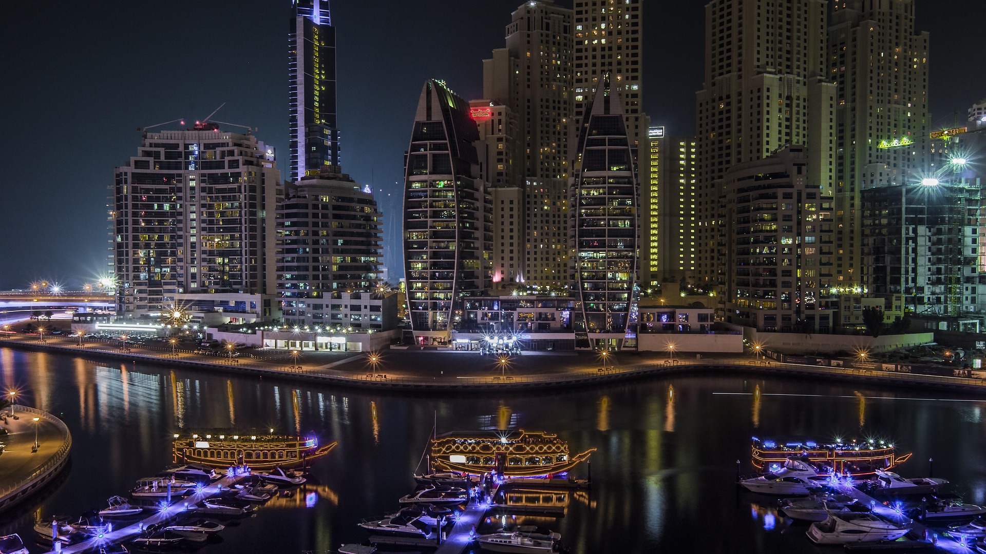 Dubai Marina at night, the kind of freehold community international buyers purchase in remotely