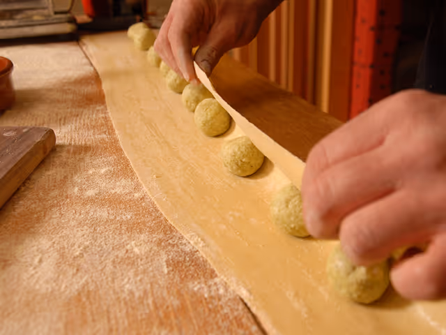 a chef preparing house-made ravioli