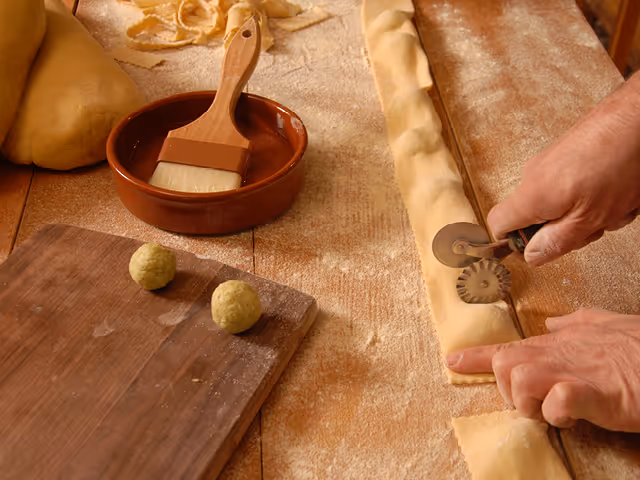 a chef preparing house-made ravioli