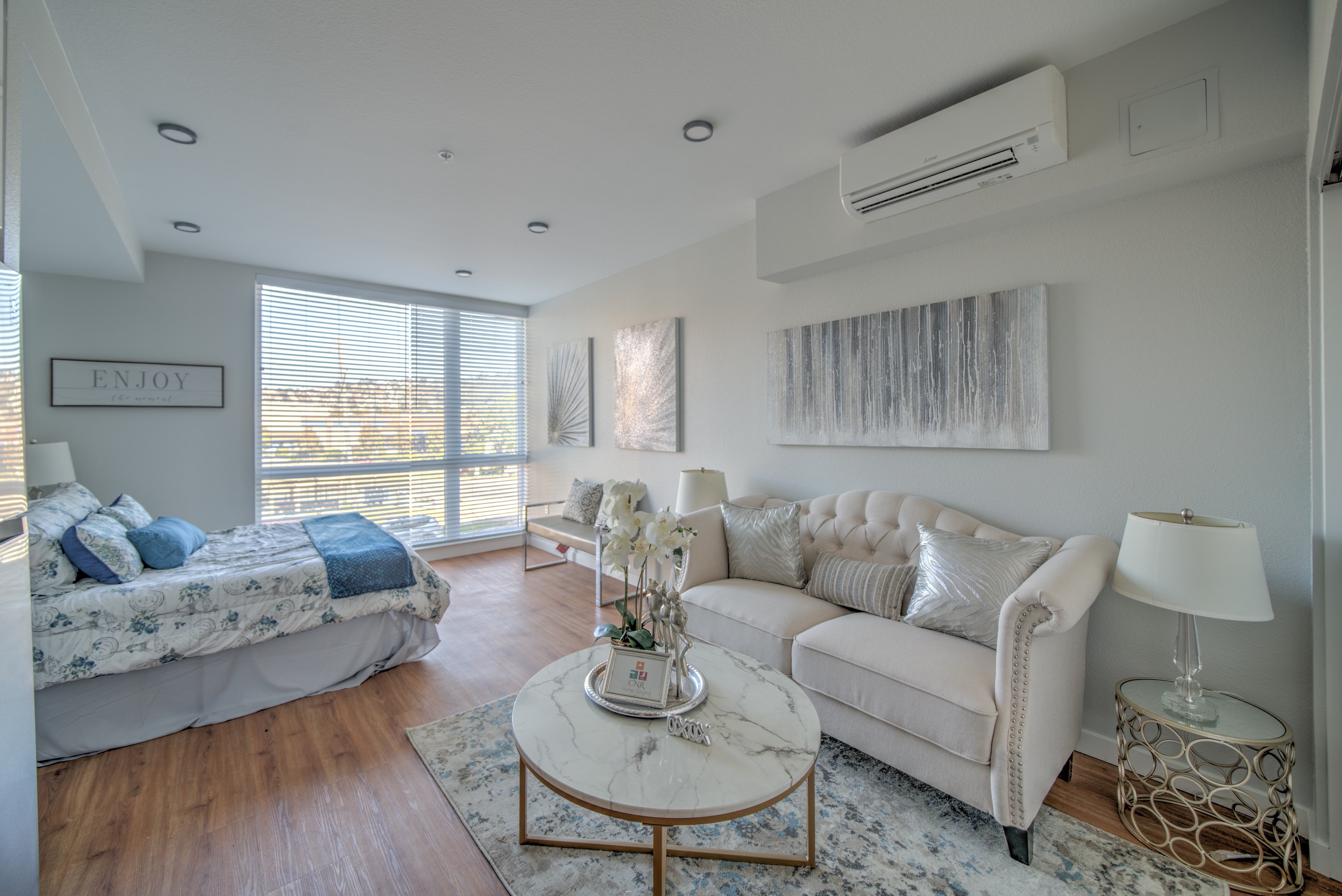 Studio full with kitchen with white and brown cabinets