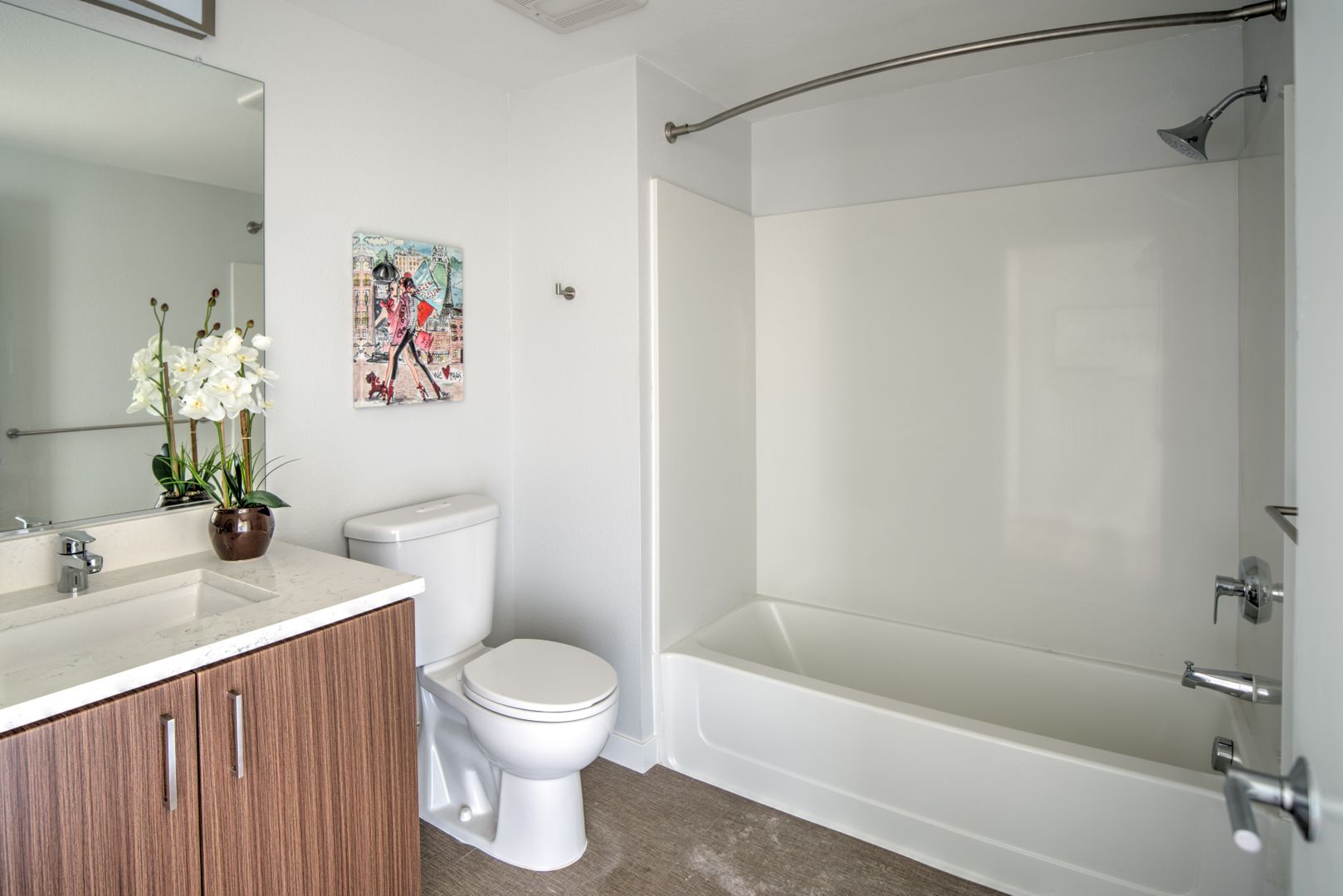 bathroom with brown cabinet