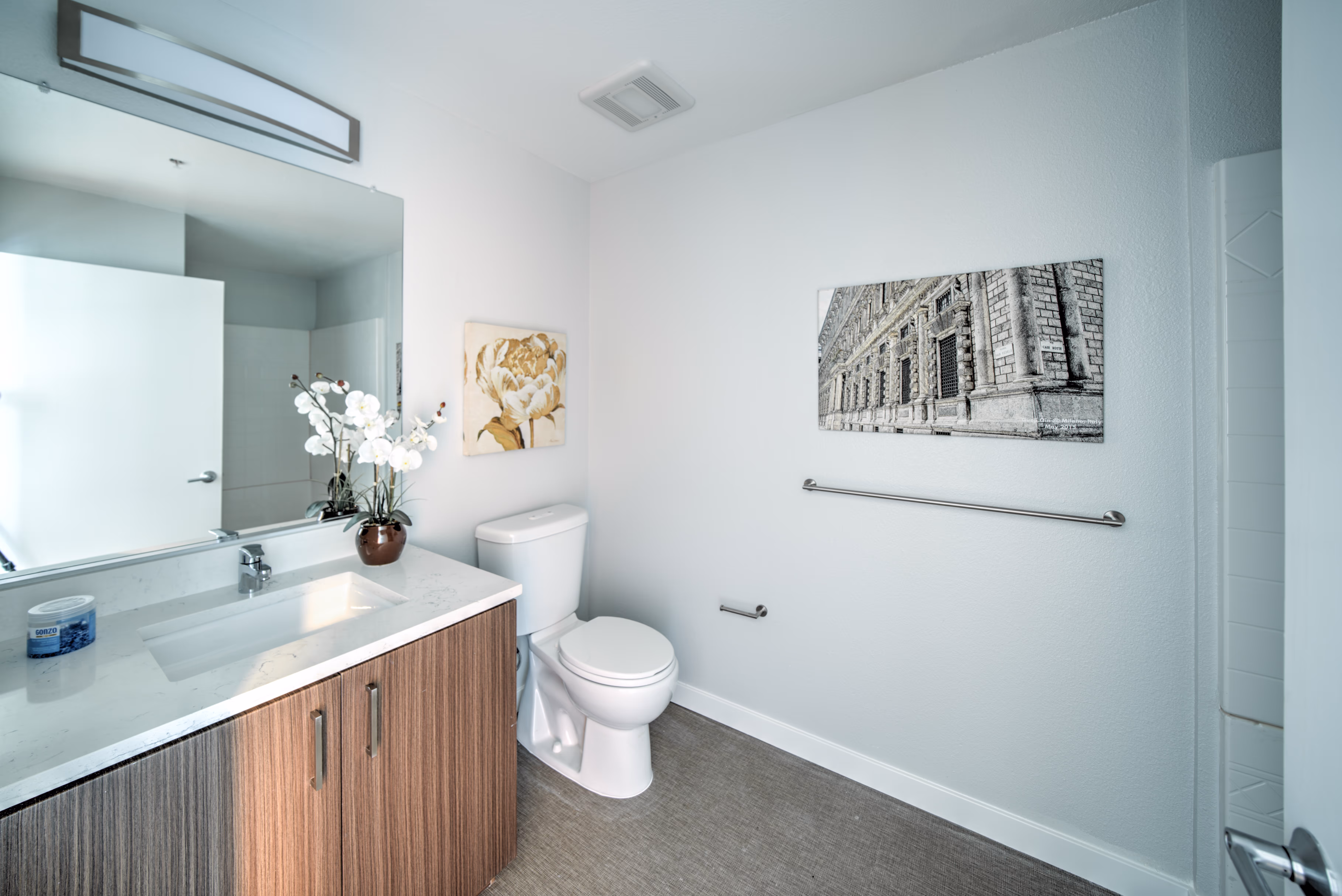 bathroom with brown cabinets