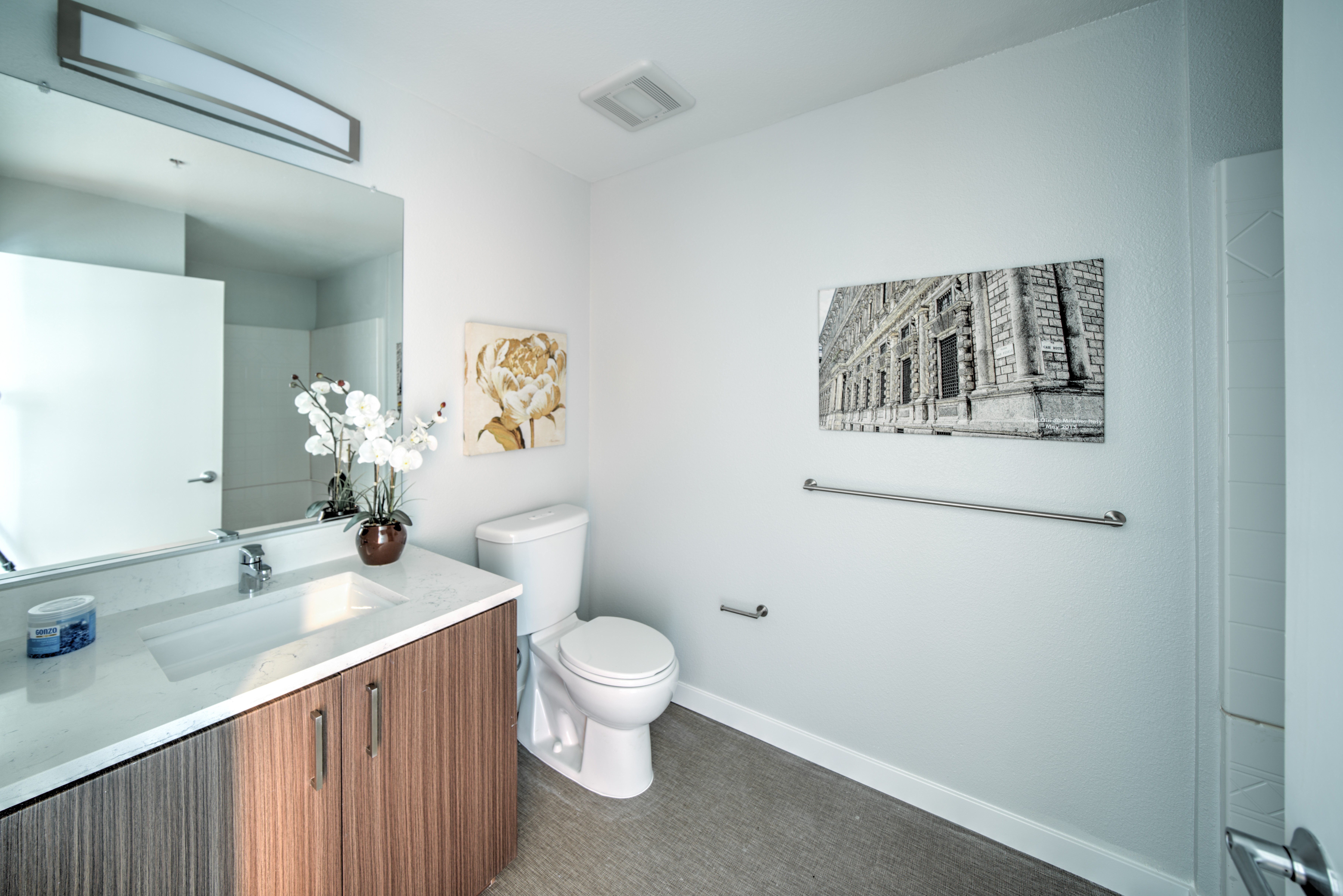 bathroom with brown cabinets