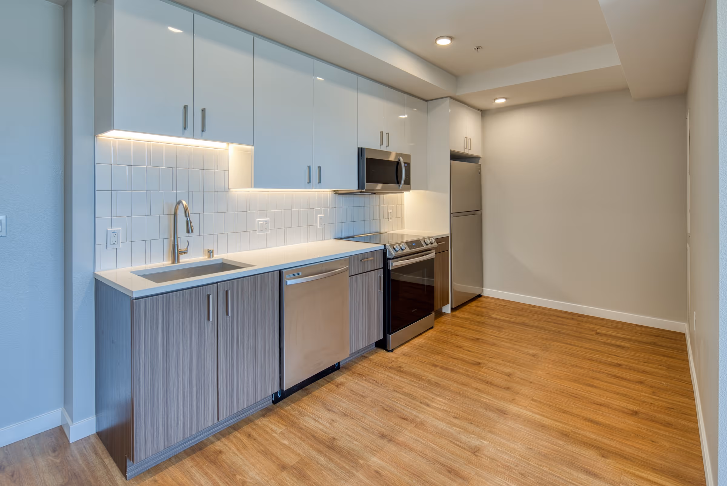 Kitchen with brown and white cabinets 