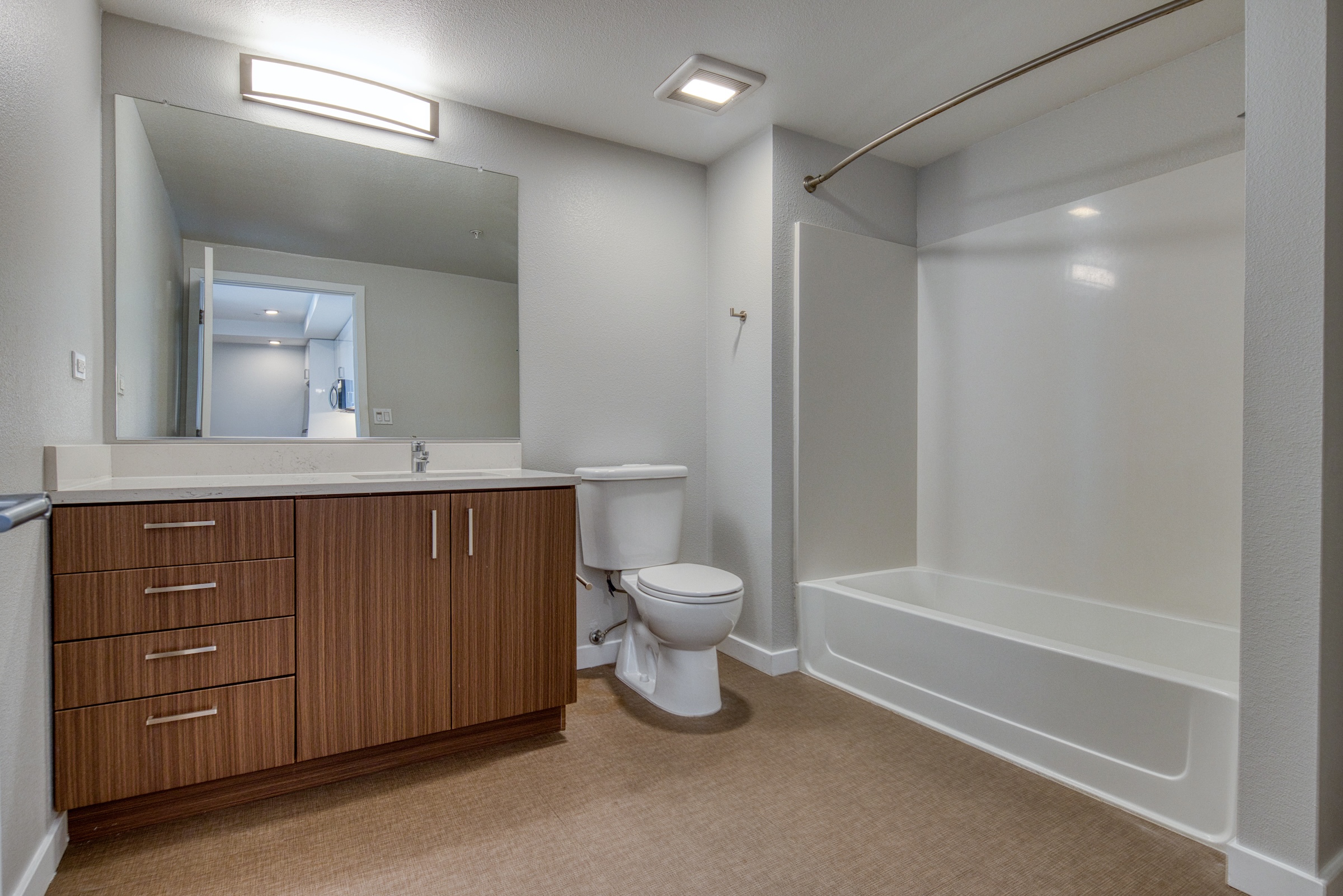bathroom with brown cabinets