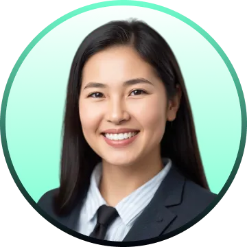 Smiling woman with long dark hair dressed in a black suit and white shirt against a green background.