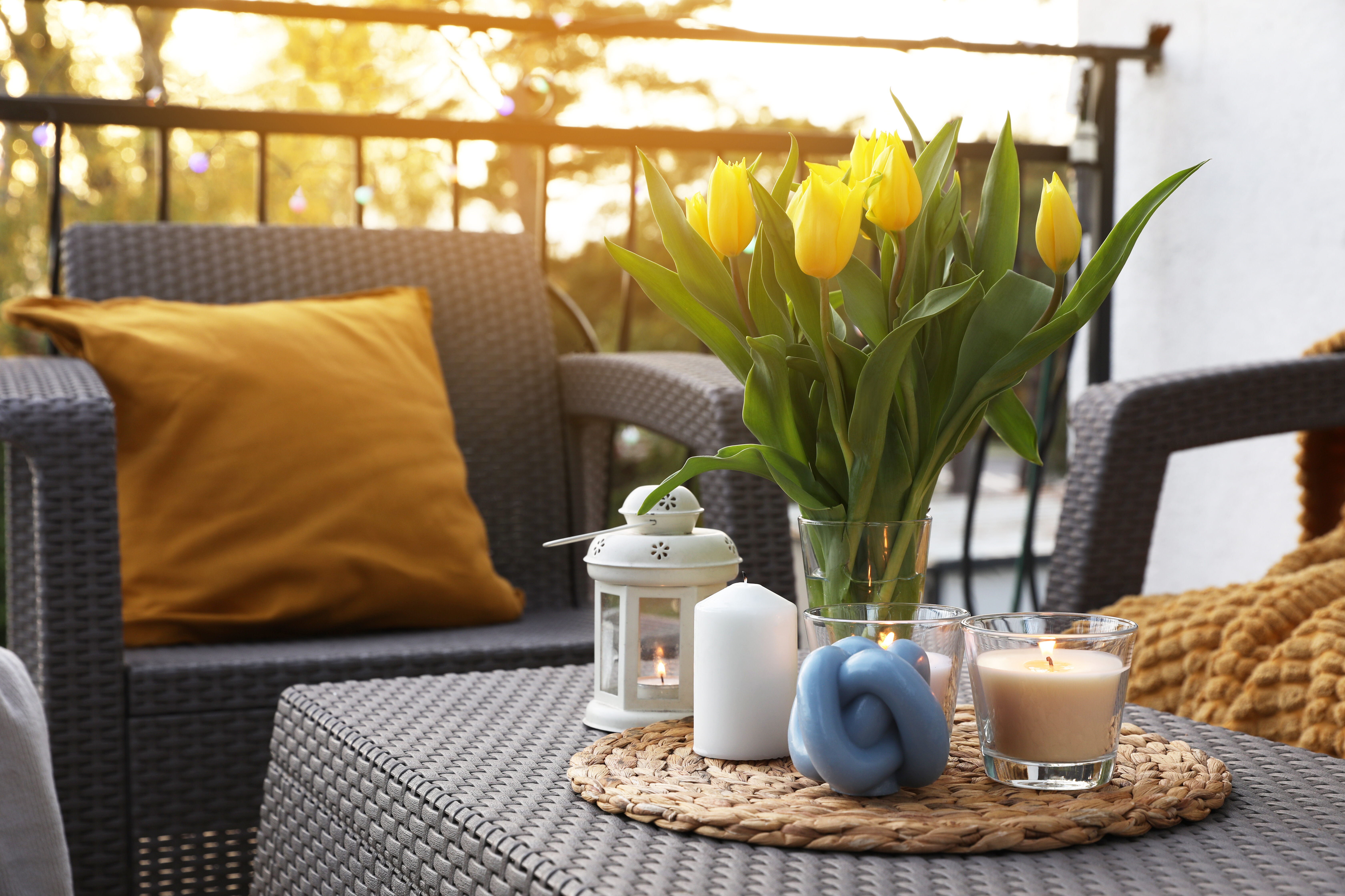 Chair next to coffee table with flowers stock image