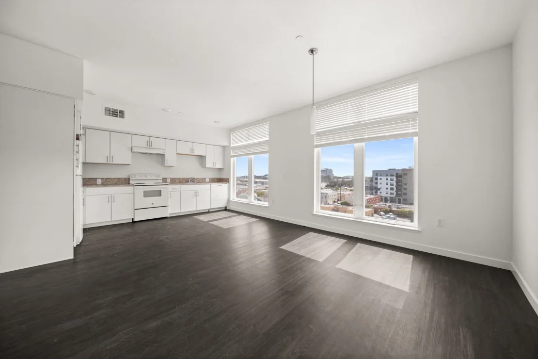 Unfurnished unit with kitchen with white appliances