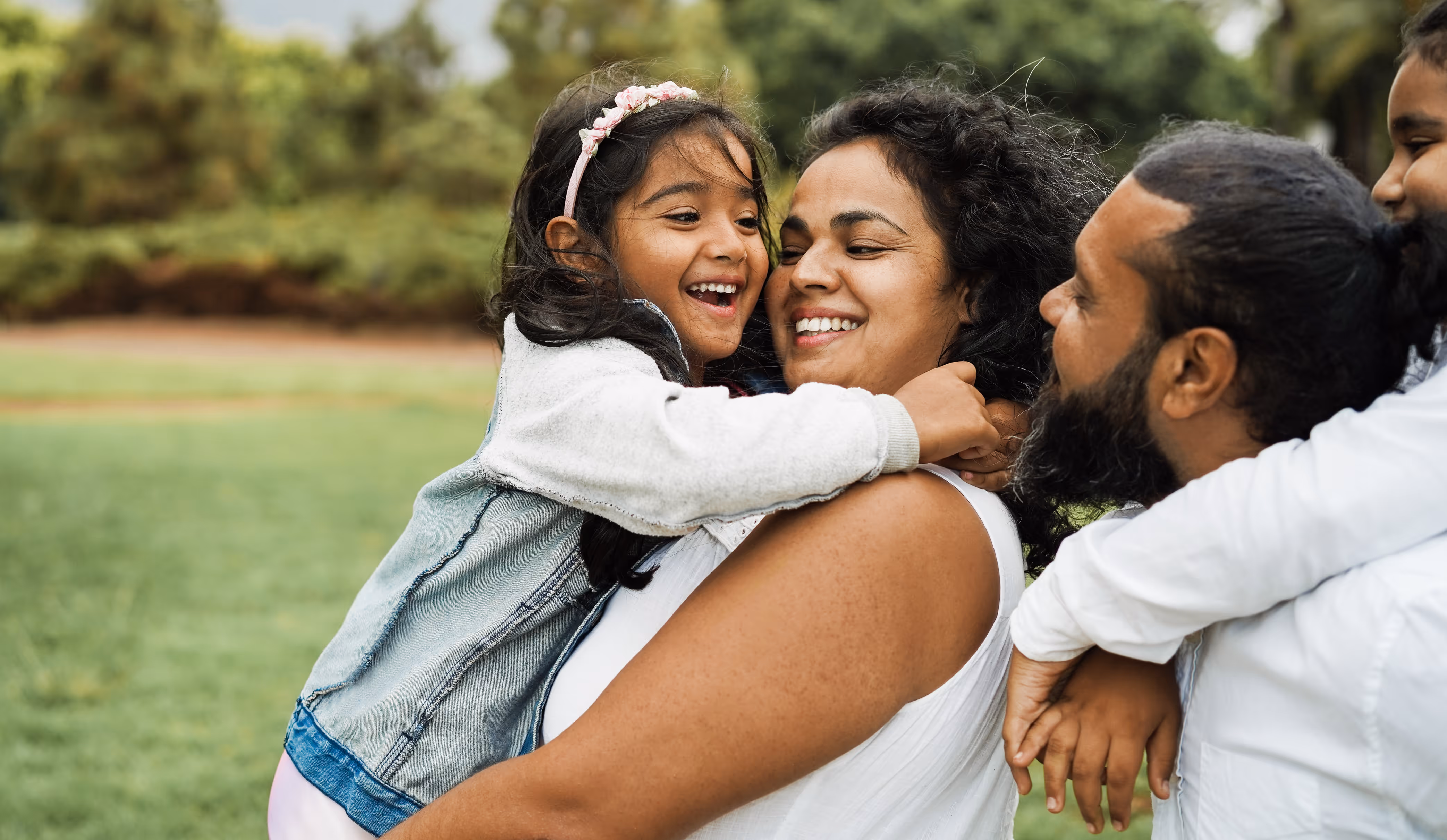 Family hugging stock image