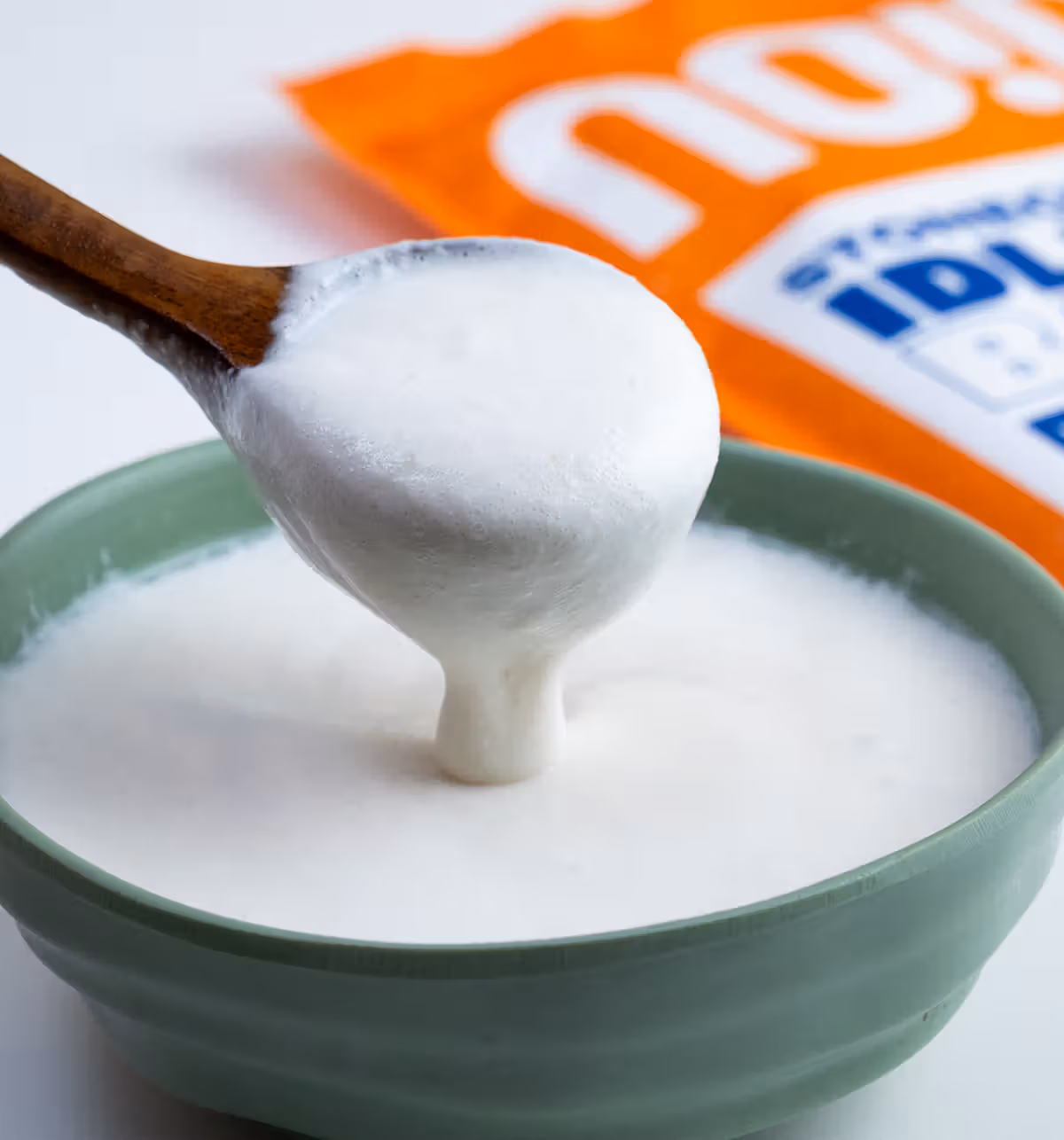 Noice Idli Dosa Batter being scooped from a bowl