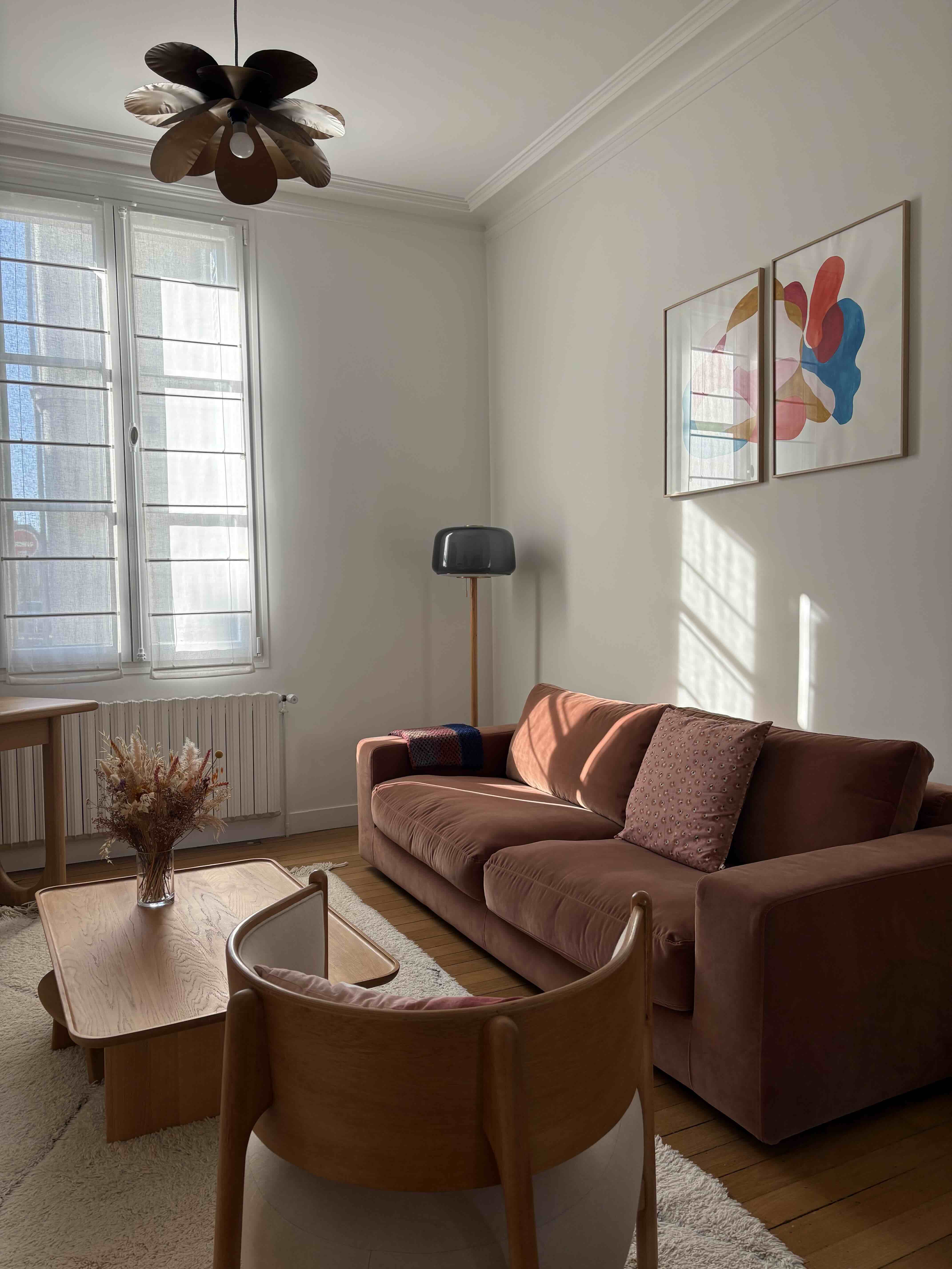 A velvet couch in a cosy room