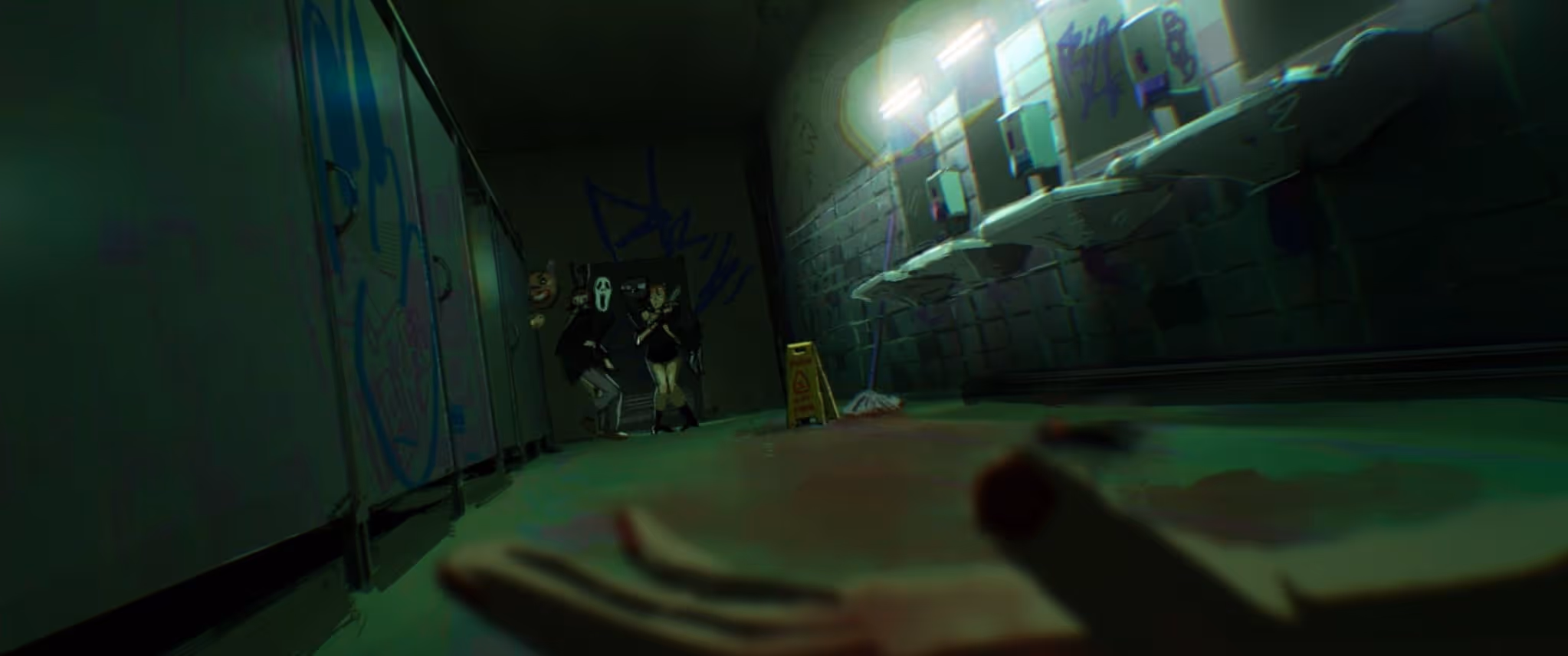 Dimly lit public restroom with graffiti, shows a person’s bloodied hand on the floor and three masked figures standing near the stalls.