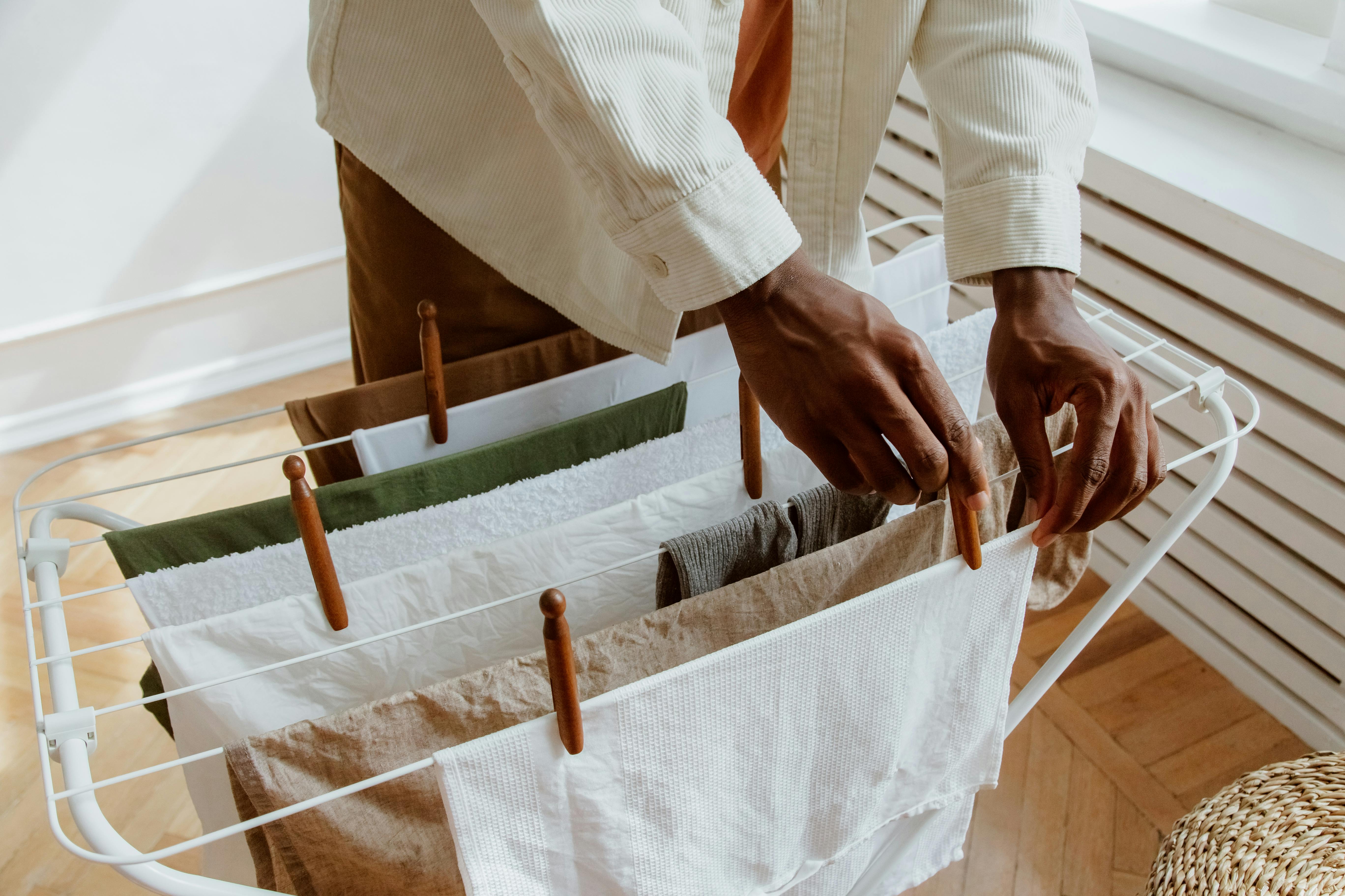 Person hanging laundry stock image