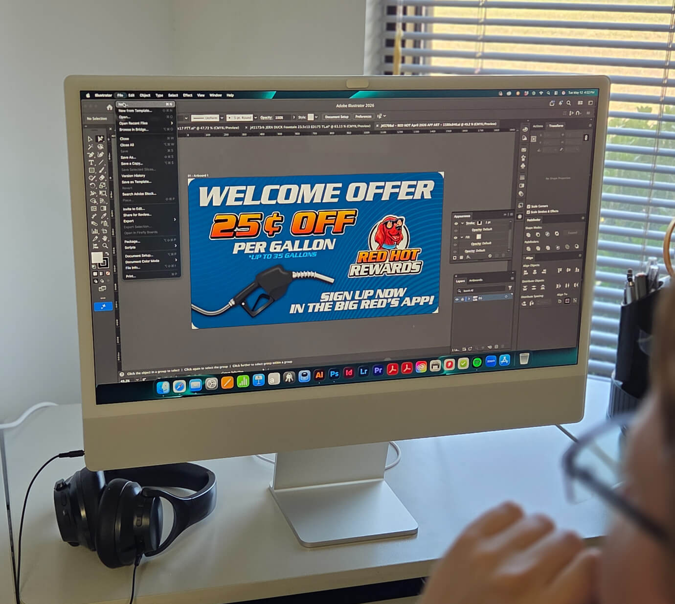 A designer creating a fuel-station Red Hot Rewards promotional graphic in Adobe Illustrator