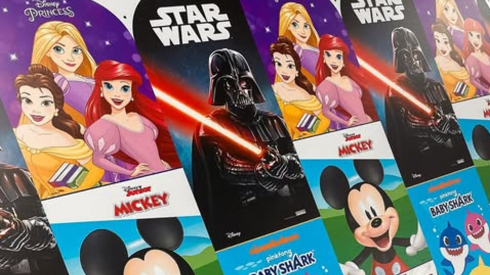 Printed children's activity-book covers featuring licensed characters