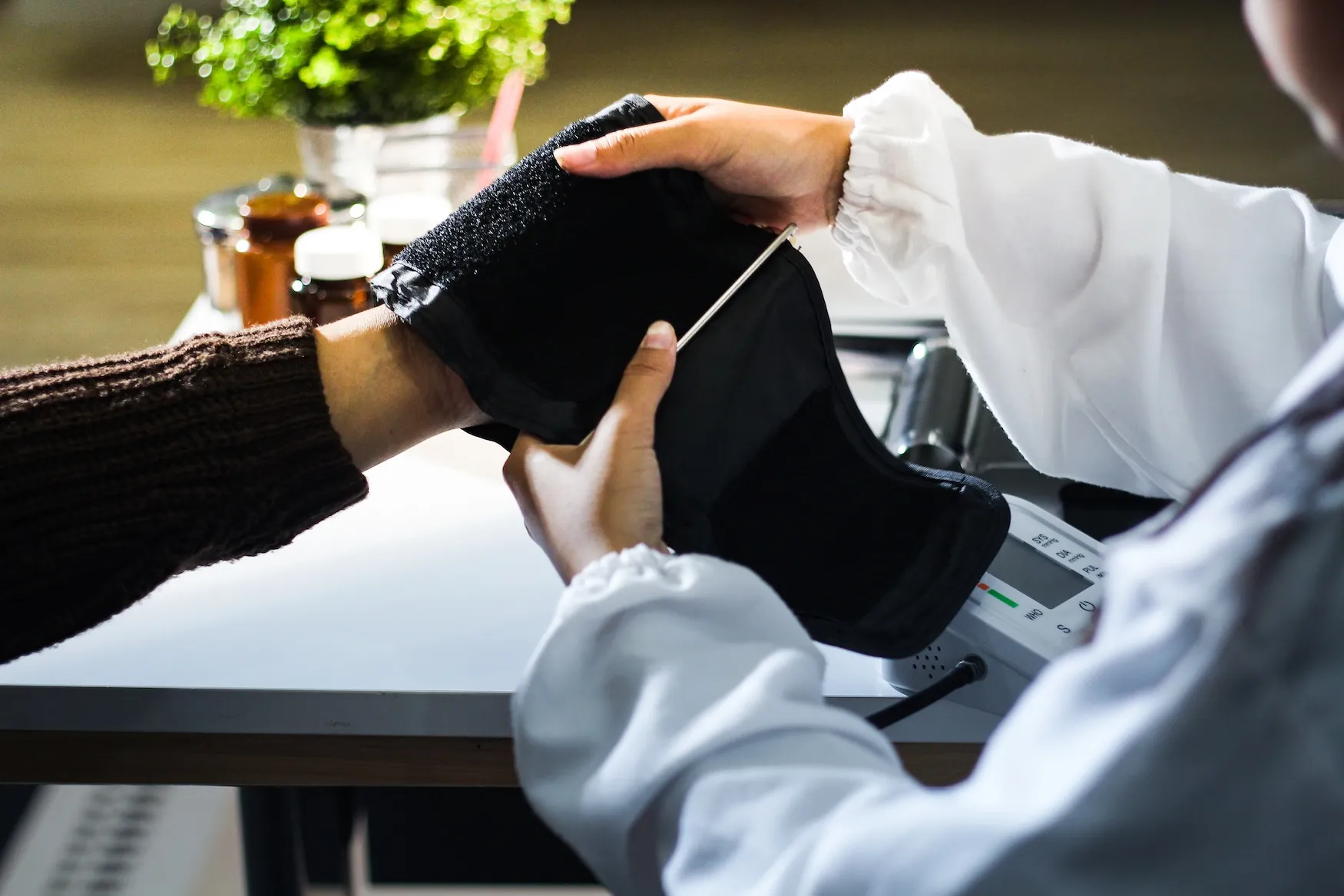 Blood pressure check during an employee health screening