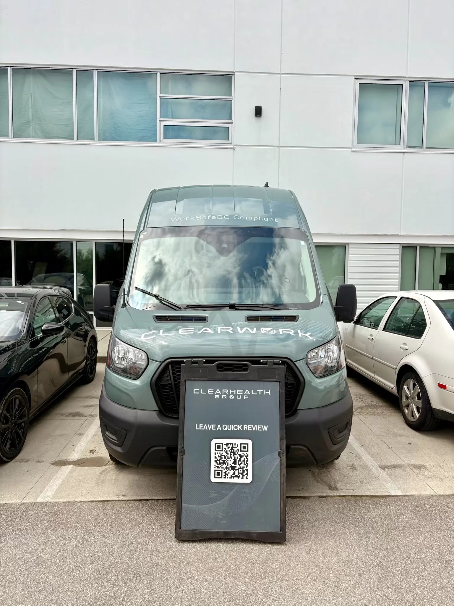 Clear Work mobile testing van parked at a commercial building