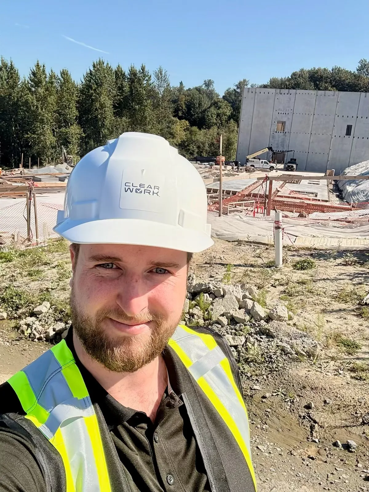 Clear Work technician in a hard hat at an active Surrey job site