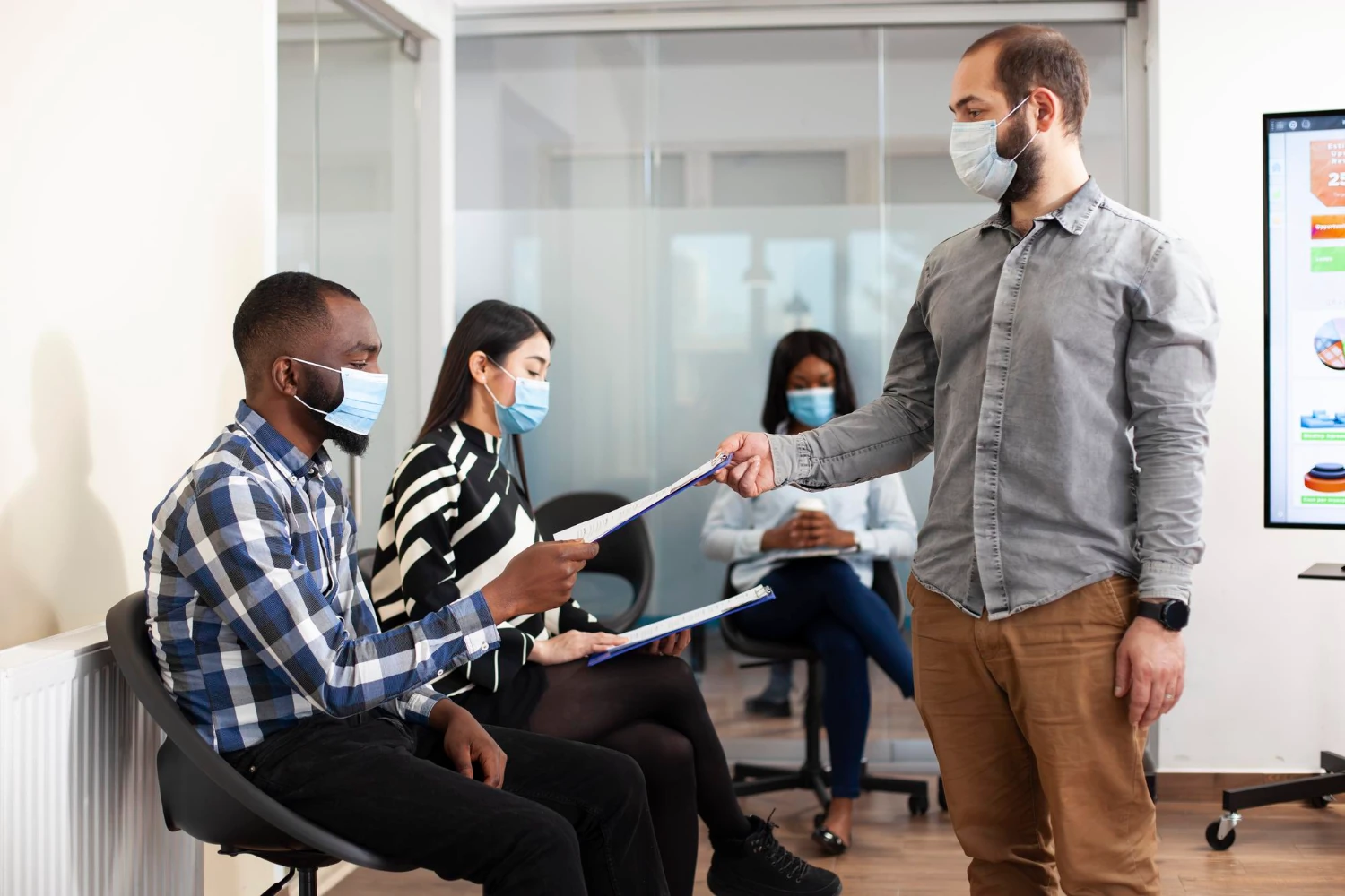 Registered Nurse running an on-site workplace immunization clinic in British Columbia