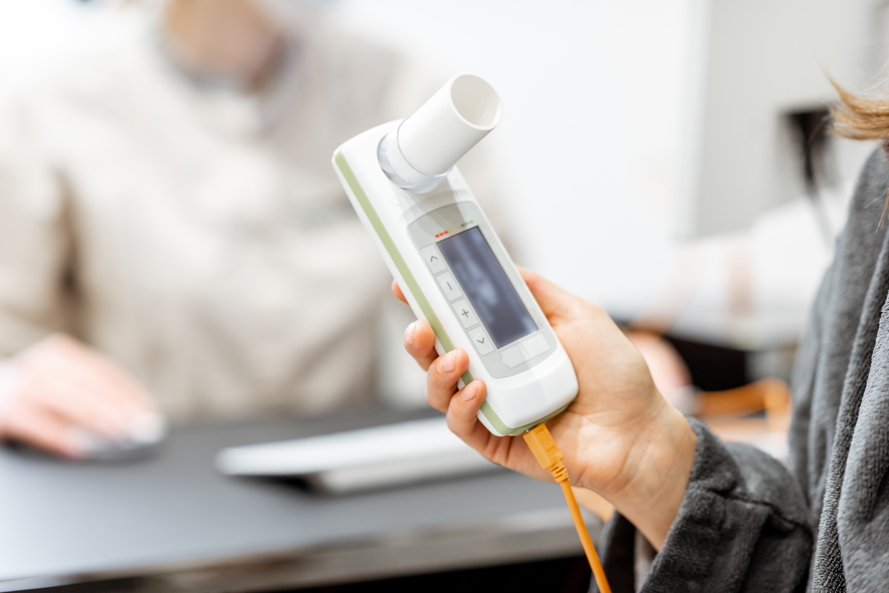 Handheld spirometer used for workplace lung function testing