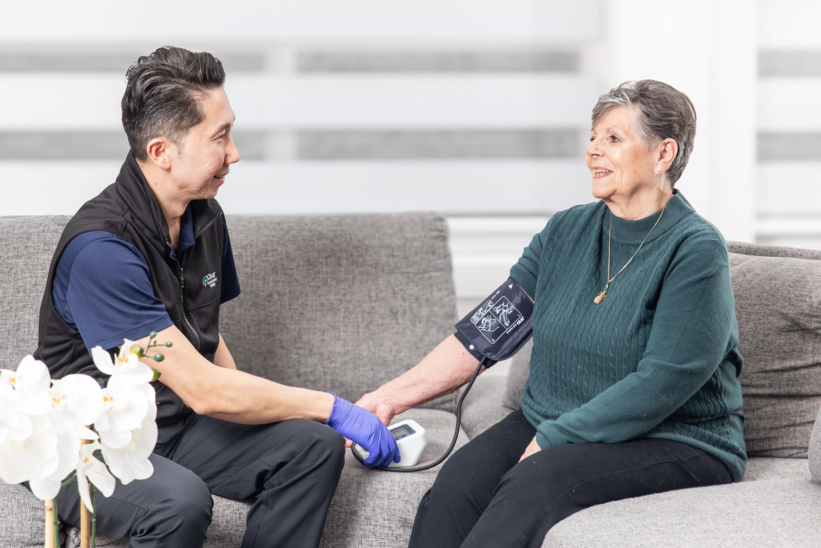 Registered nurse wellness check at home for a senior