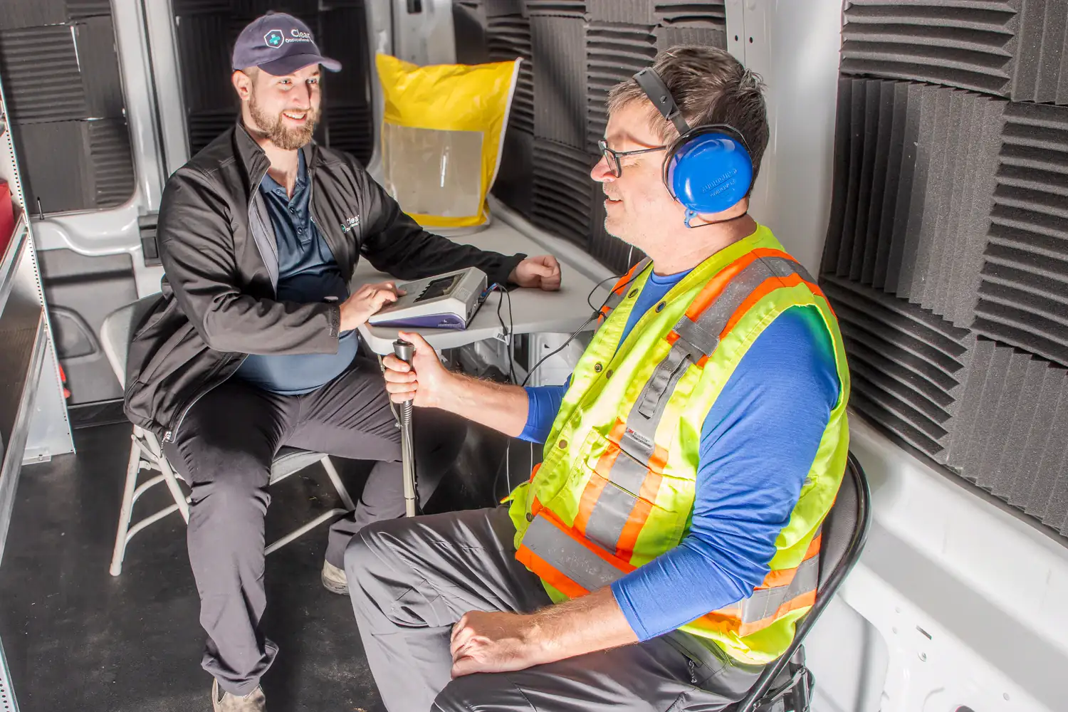 Mobile hearing test inside a Clear Health Group mobile testing unit