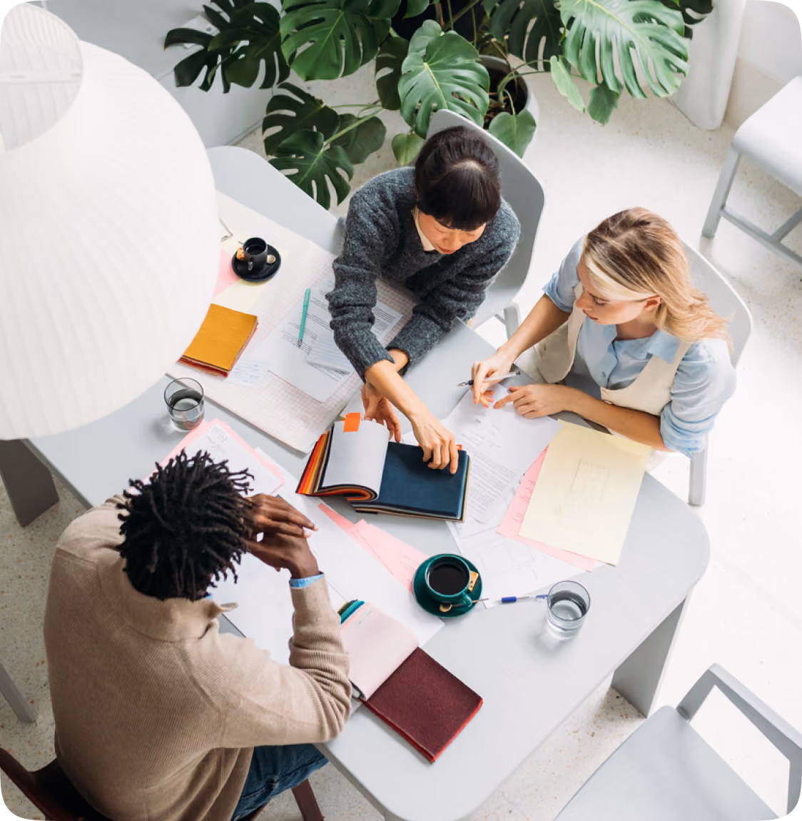 Overhead view of a diverse team collaborating around a table