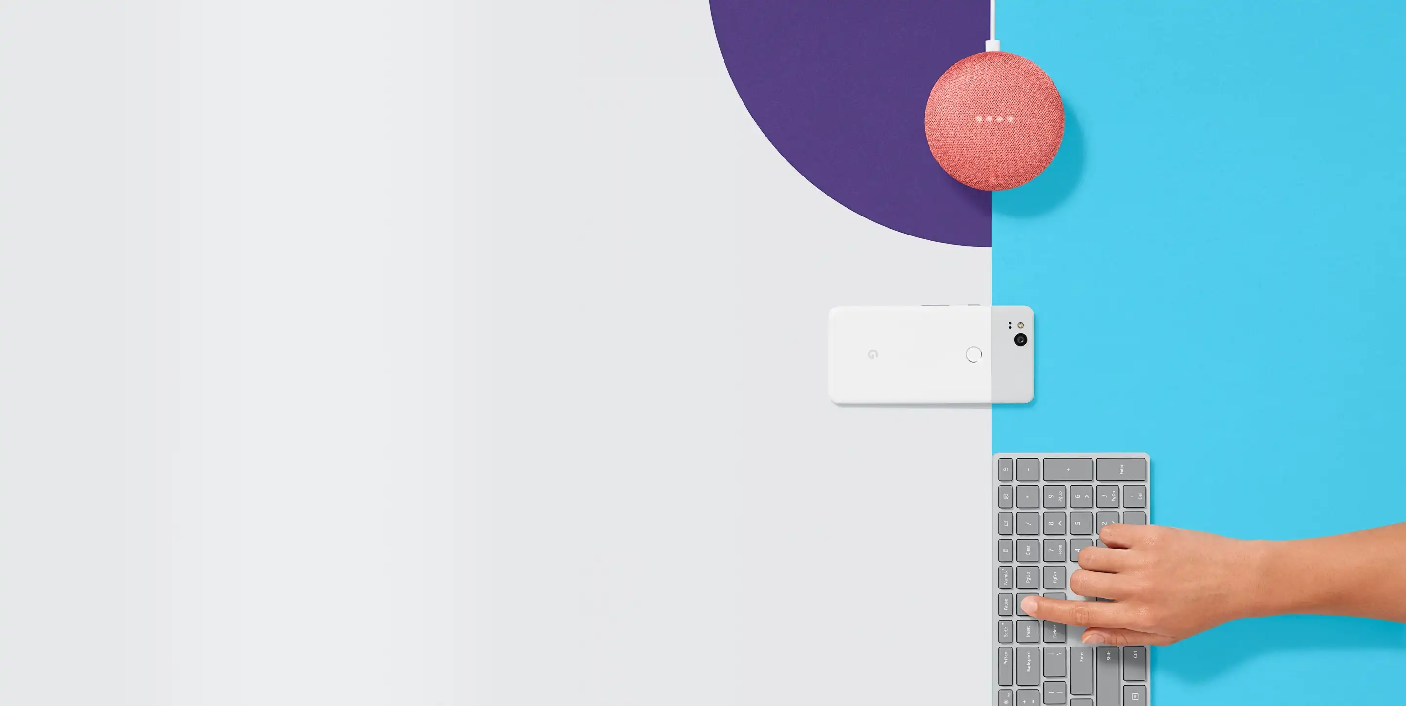 Coral Google Home Mini speaker on an abstract geometric background