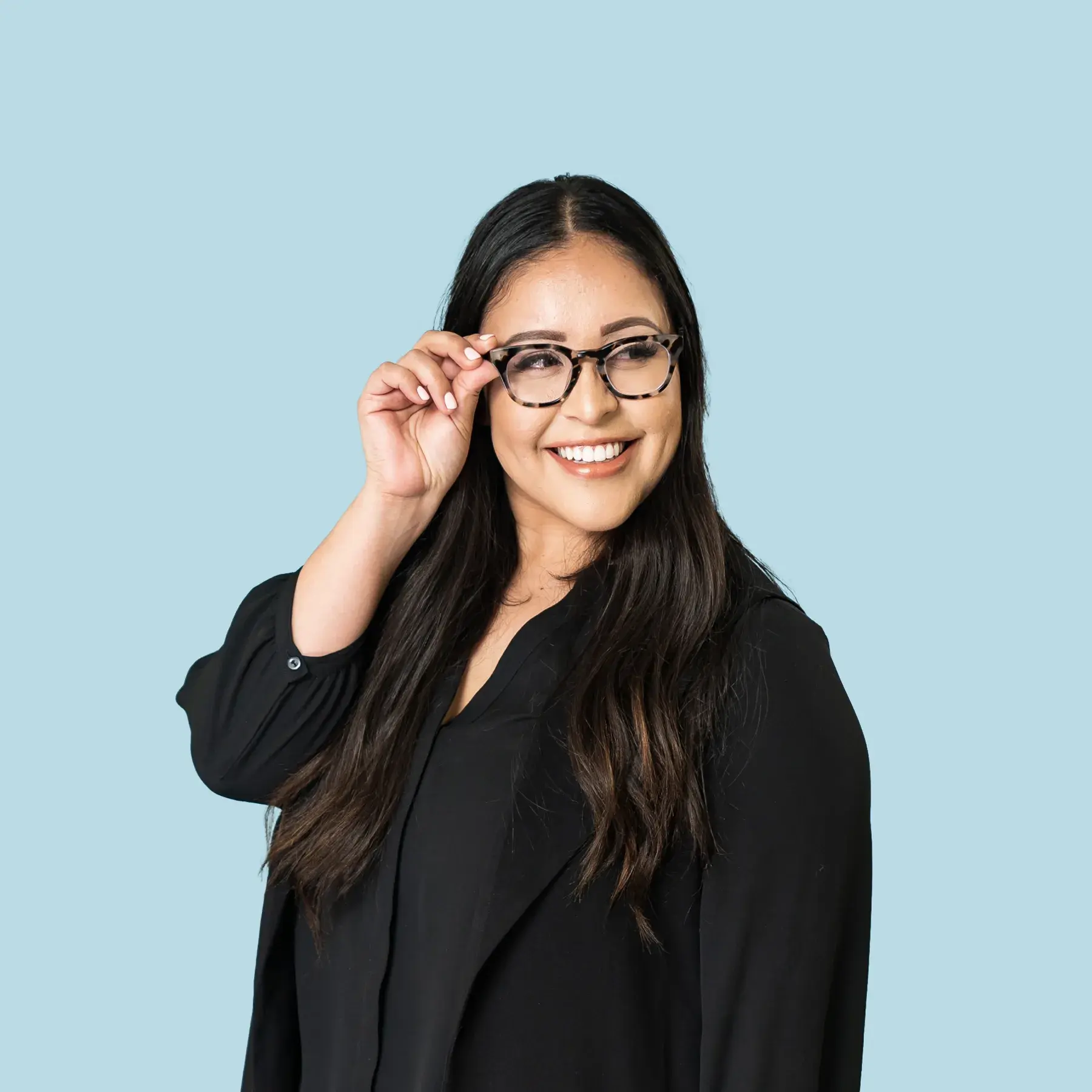 Smiling professional woman wearing glasses in a black top