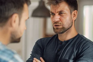 two men discussing something intently