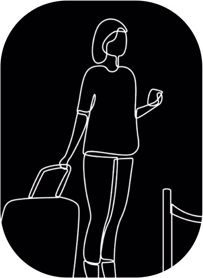 A woman with a suitcase is walking.