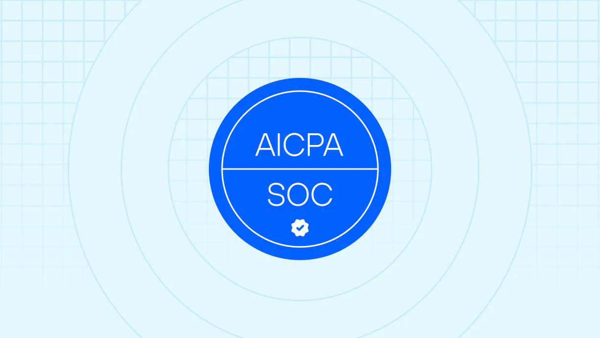 Blue circular badge with text 'AICPA' above a line and 'SOC' below it with a small checkmark icon underneath, set against a light blue background with grid and concentric circles.