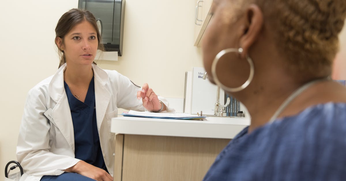 Doctor in consultation with patient at a medical clinic, discussing treatment options