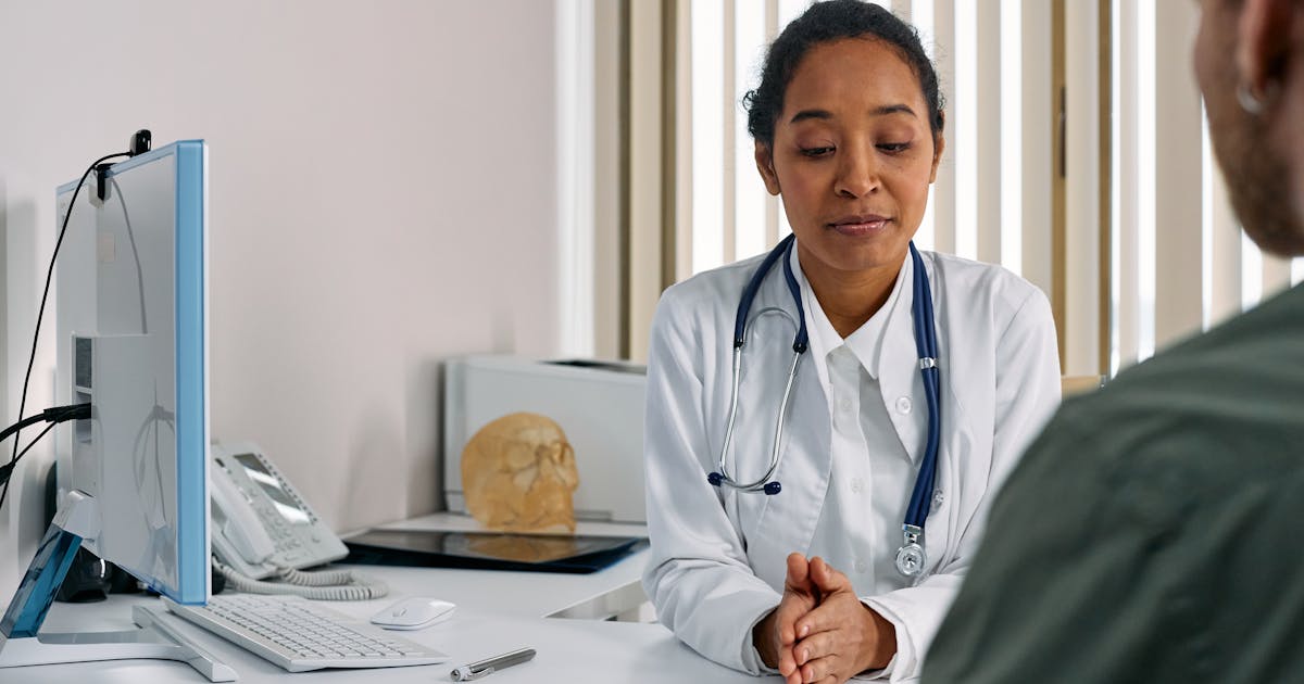 Female doctor consulting a patient in a modern medical office setting
