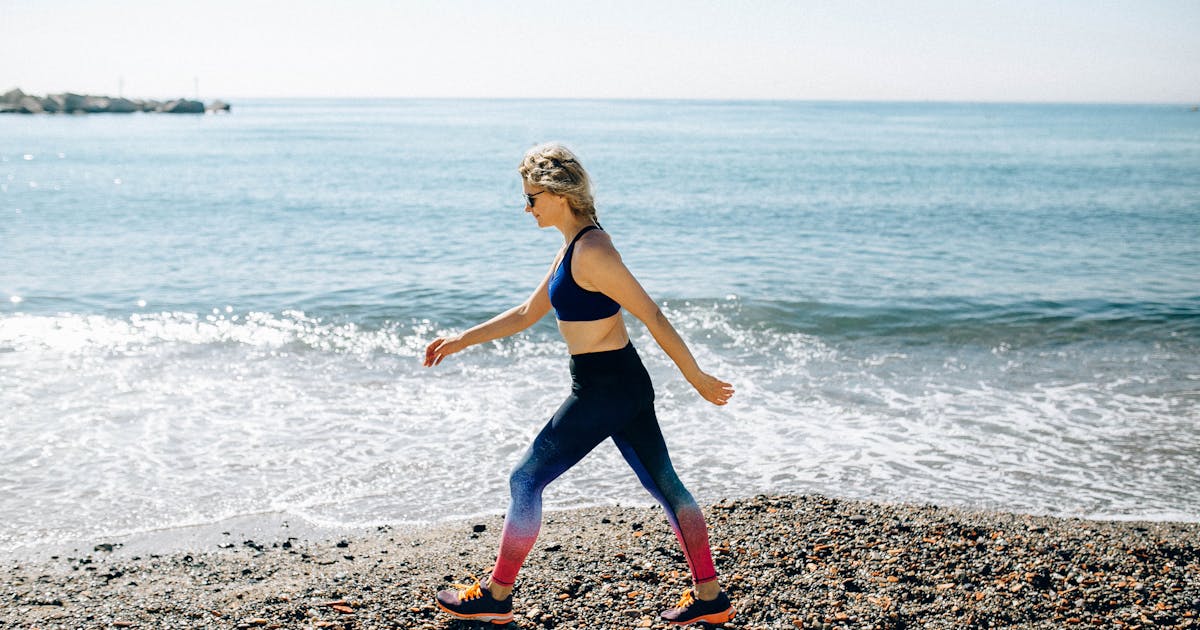 An active woman walking outdoors for exercise