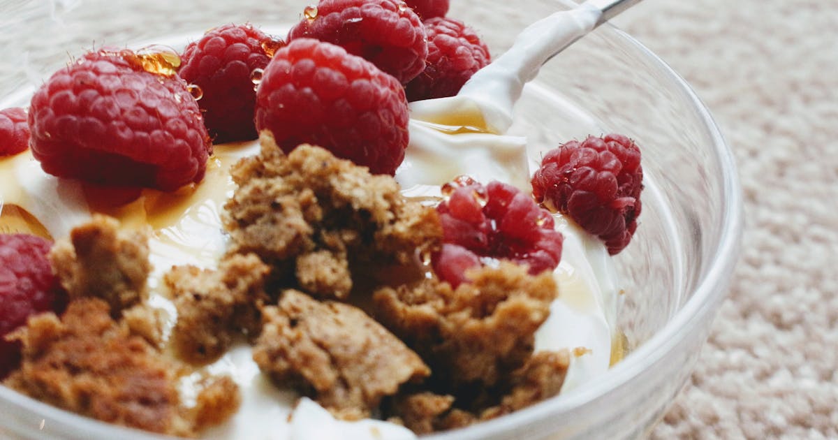 Greek yogurt with biscuit crumb and fresh raspberries