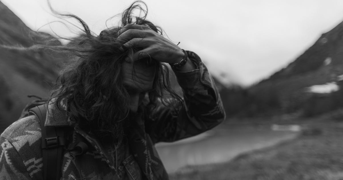 A man fixing his hair