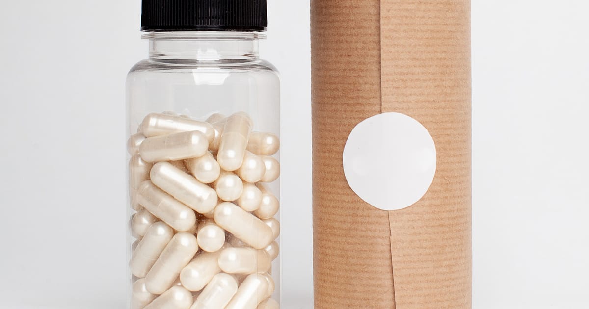 Capsules in a plastic bottle representing dietary supplements