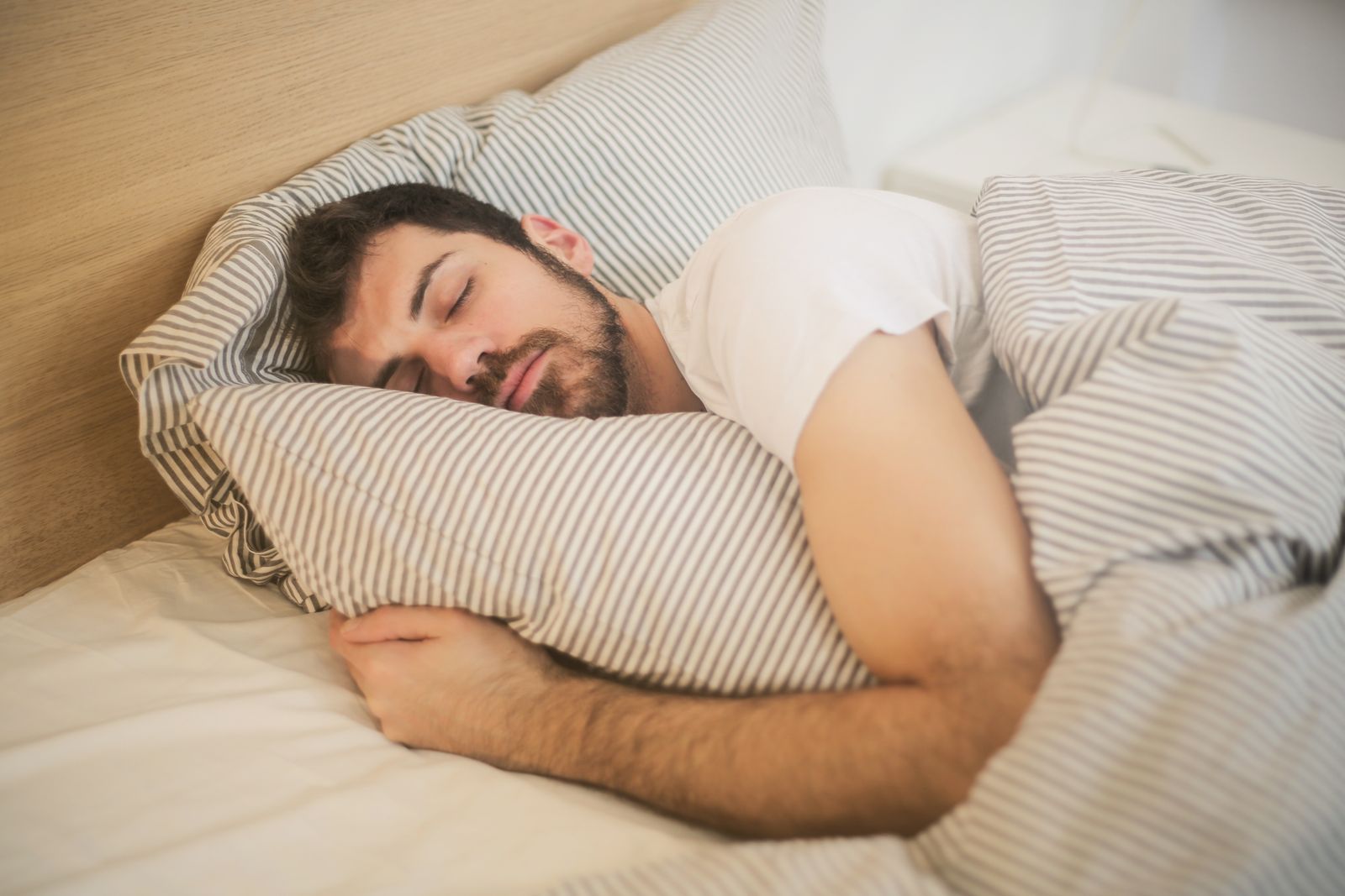 A person resting peacefully in bed