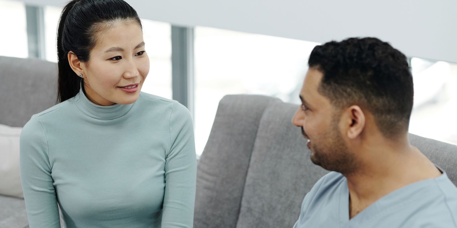 A woman talking with her doctor in a clinic