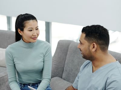A woman talking with her doctor in a clinic