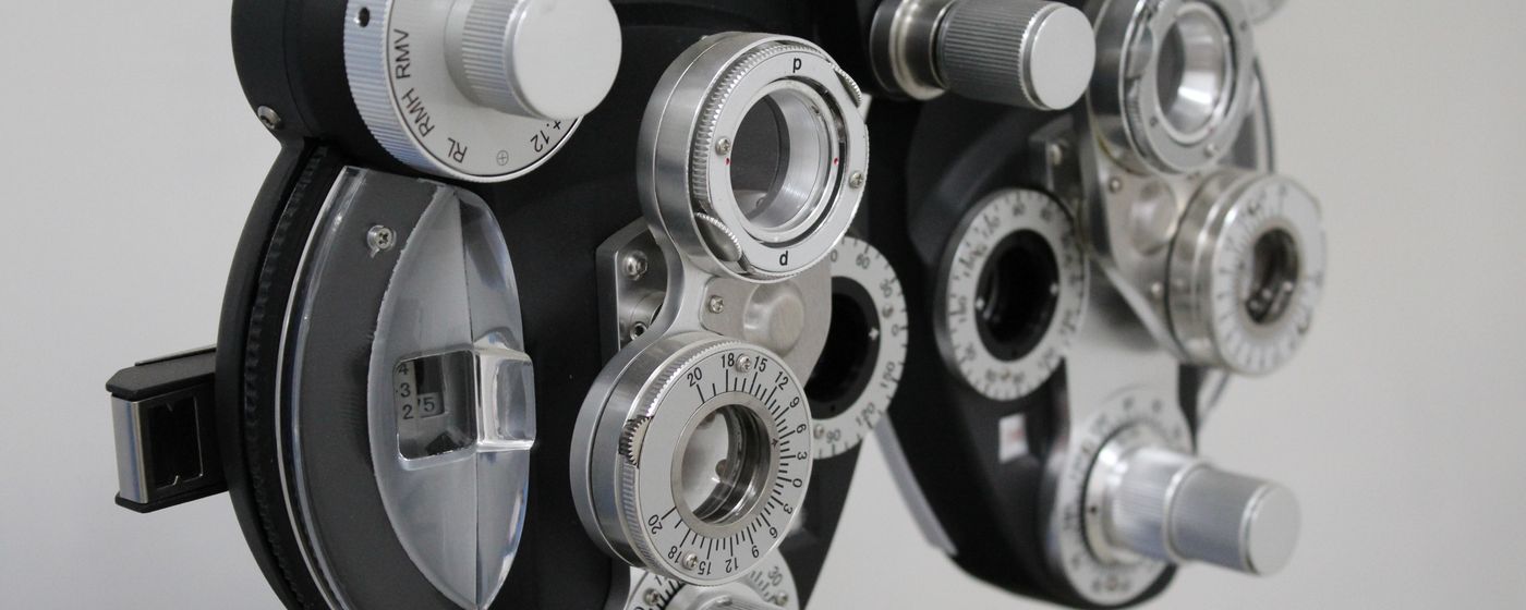 A close-up of a phoropter, the lens instrument used in eye exams