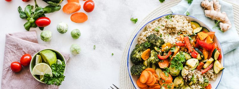 An overhead view of a colorful vegetable and grain salad bowl