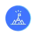 Icon of a mountain with a flag on top and rays indicating achievement inside a blue circle.