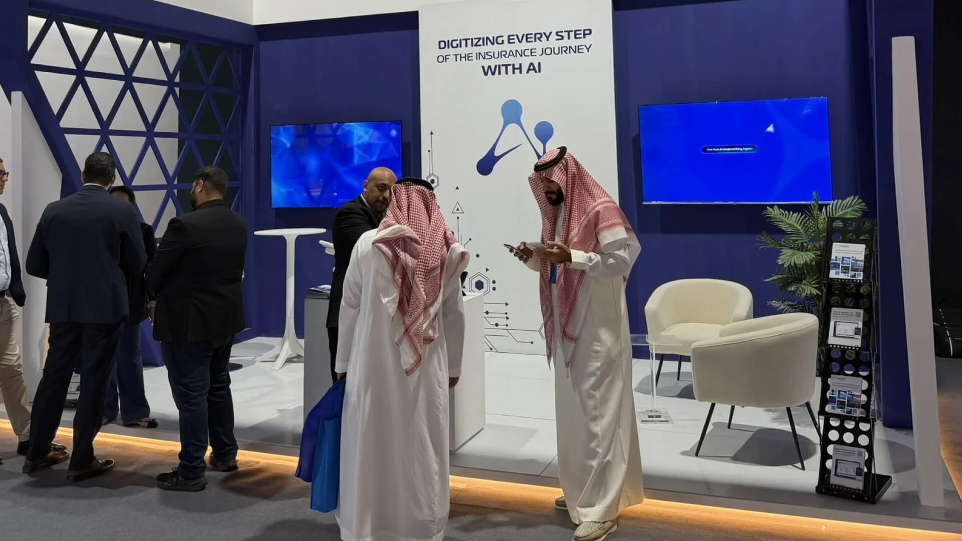 Bashir discussing with local experts at KSA InsurTech