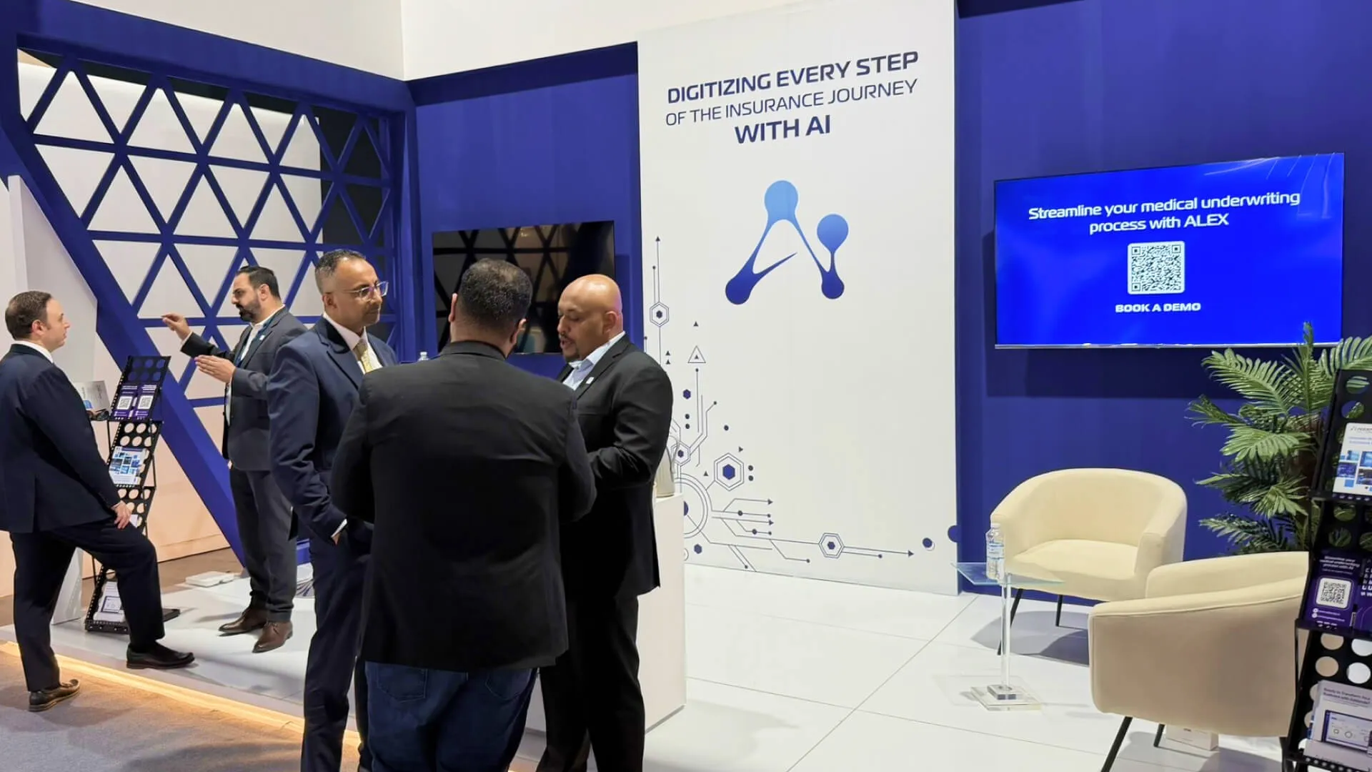 Bashir discussing with experts at KSA InsurTech