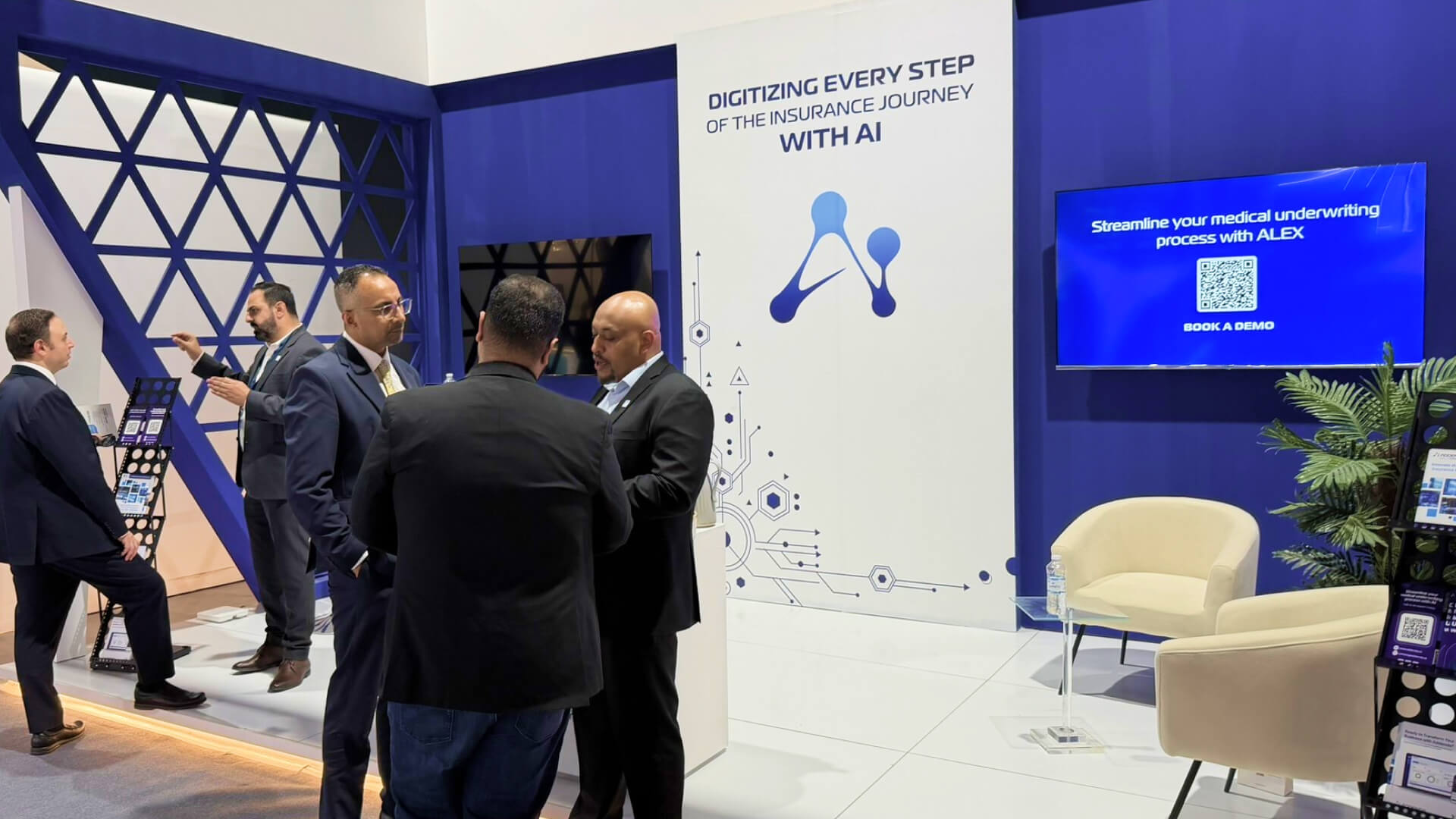 Bashir discussing with experts at KSA InsurTech
